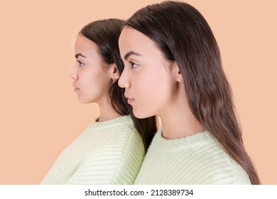 Close-up Profile Of Two Twin Sisters