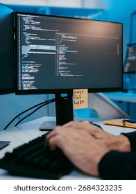 Close-up Programmer Hands Typing on Keyboard, Screen Showing Line of Software Code, Male Software Engineer working on computer writing code, Software Development, Focused on Information Technology.