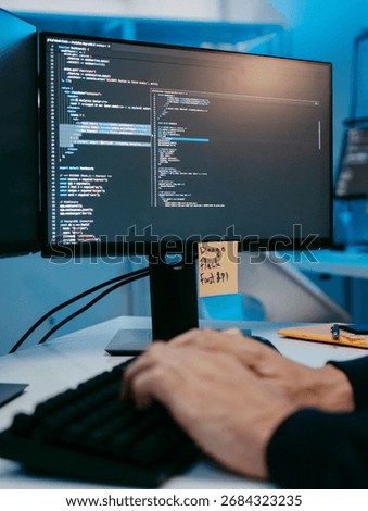 Close-up Programmer Hands Typing on Keyboard, Screen Showing Line of Software Code, Male Software Engineer working on computer writing code, Software Development, Focused on Information Technology.