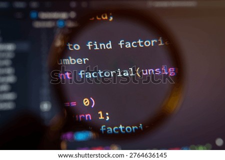 Close-up of programming code magnified through lens, highlighting algorithm and function logic, representing software development, coding analysis, debugging process, and modern technology engineering concept.