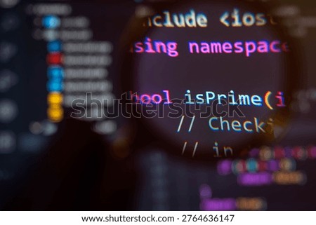 Close-up of programming code magnified through lens, highlighting boolean function and algorithm logic, representing software development, code analysis, debugging, and modern technology engineering concept.