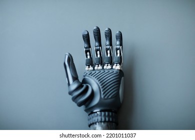 Close-up Of Prosthetic Arm For People With Disability Isolated On Blue Background