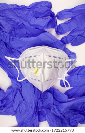 close-up protection against coronavirus gloves and medical mask on a white background