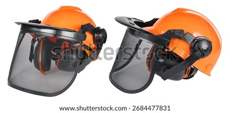 Closeup of protective chainsaw helmets with mesh visor and ear defenders isolated on white background. Front and side view of orange safety gear for head protection with net face shield for eye guard.