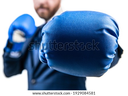 closeup punch of cropped businessman man in boxing gloves ready for corporate business battle, selective focus, knockout.