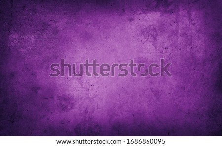 Closeup of purple textured grunge background. Dark edges