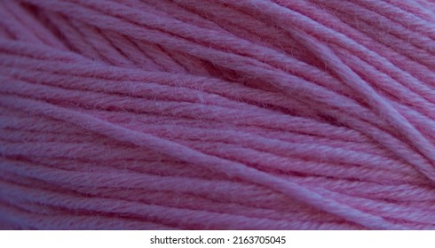 Close-up of purple threads, textile background.