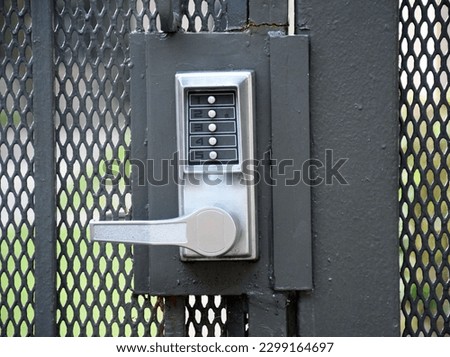 Closeup of a push button security lock at a complex
