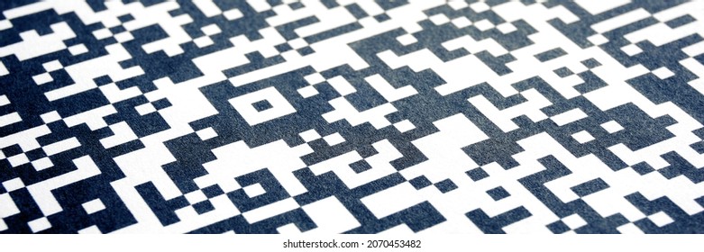 Close-up of QR code printed on paper. Abstract QR background banner.