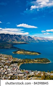 Closeup Of Queenstown With Lake Wakatipu From Top At Noon.