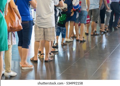 Closeup Queue Of Asian People Waiting At Boarding Gate At Airport