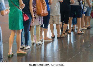 Closeup Queue Of Asian People Waiting At Boarding Gate At Airport