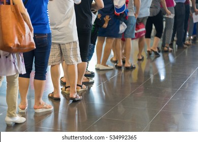 Closeup Queue Of Asian People Waiting At Boarding Gate At Airport