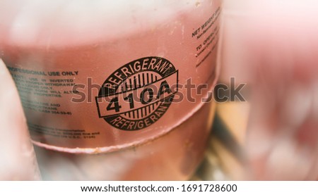 Closeup R 410A refrigerant tank, using the pink symbol for industrial air conditioners in hanging buildings
 [[stock_photo]] © 