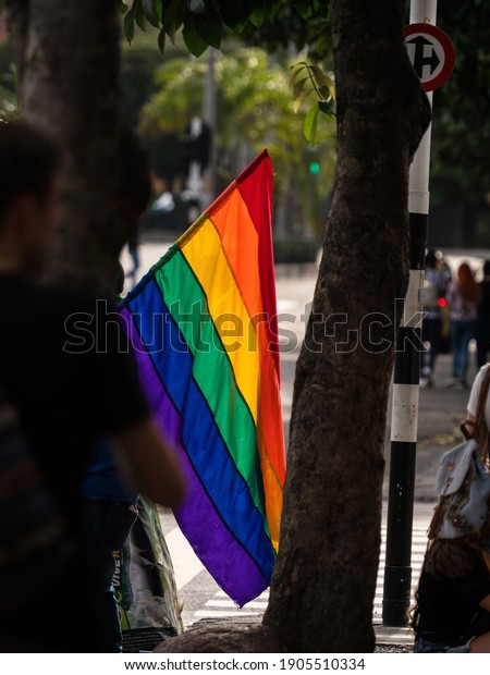Closeup of\
rainbow flag at LGBTQI march gay parade pride celebration event in\
streets of Medellin Colombia South\
America