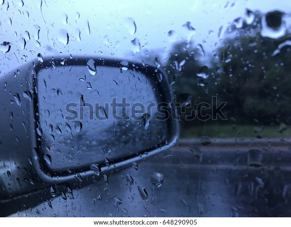 Closeup raindrop on window car glass , inside car
view raining seasons