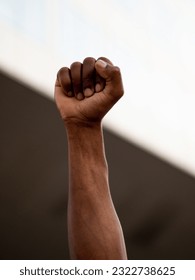 Close-up of a raised fist of an African person at a demonstration against racism.Black Lives Matters 