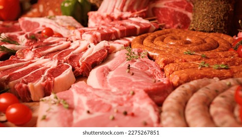Close-up of raw meat lamb and pork cuts on the table in meat industry. Butchered beef meat ready for restaurant cooks. - Shutterstock ID 2275267851