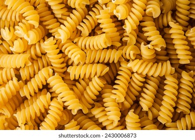 Close-up of raw, uncooked fusilli pasta. - Powered by Shutterstock