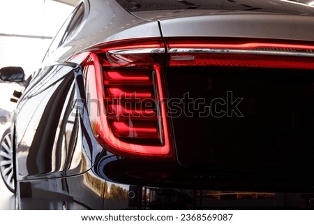 Close-up of the rear light of a modern car. Led optics of the car. Detail on the rear light of a car. Car detail. Developed Car's rear brake light. Automotive concept