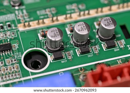 Close-up of rectifier diodes next to capacitors on a printed circuit board.