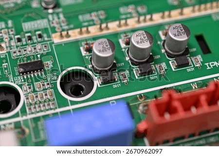 Close-up of rectifier diodes next to capacitors on a printed circuit board.