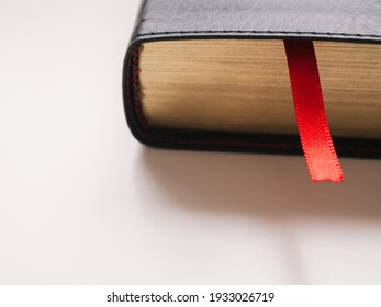Close-up red bookmark with copy space. Book day concept