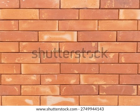 Close-up of Red Brick Wall Texture with Natural Weathered Surface