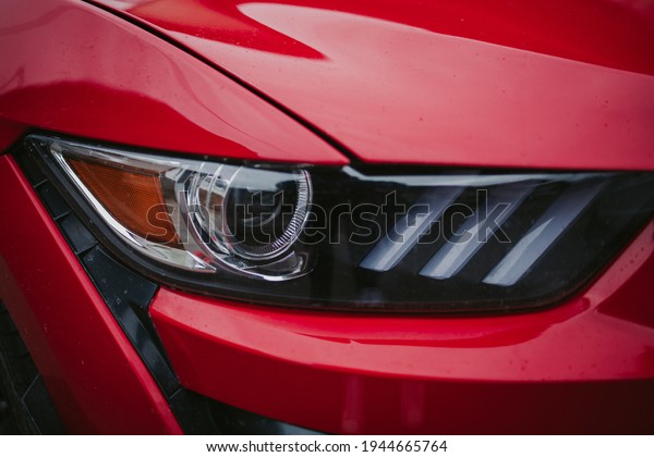 A closeup of a red car\
signal light