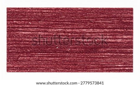 Close-up of a red crayon texture on white paper, showing the rough, waxy strokes and pigment particles.