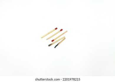 Closeup Of Red Head Matchstick And Burning Matchstick