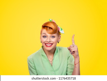 Closeup Red Head Young Woman Pretty Pinup Girl Green Button Shirt Pointing Finger Up Has A Brilliant Idea Sign Gesture Looking At You Camera Isolated Yellow Background Retro Vintage 50's Style.