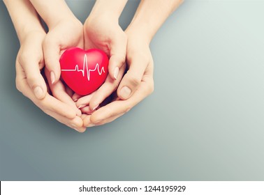 Close-up red Heart in hands, love concept - Shutterstock ID 1244195929