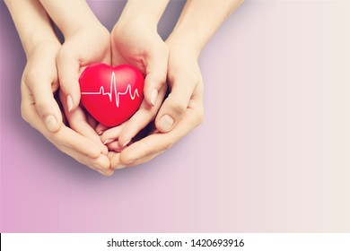 Close-up red Heart in hands, love concept - Shutterstock ID 1420693916