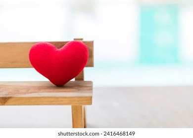 Closeup red heart on wooden chair with space on blurred background, outdoor day light, love and romance concept, simple valentine card background idea - Powered by Shutterstock