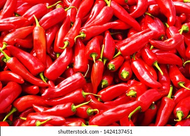 Closeup of red hot chilly pepper (Capsicum annuum) for sale. Red chilies displayed on pull cart for sale by the roadside. Incredible India.
