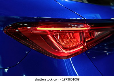 close-up of a red led taillight on a modern car, detail on the rear light of a car
