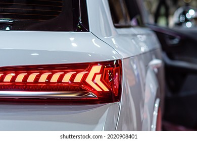 close-up of a red led taillight on a modern car, detail on the rear light of a car