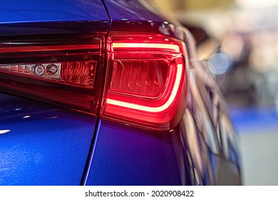 close-up of a red led taillight on a modern car, detail on the rear light of a car