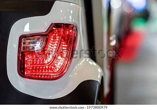 close-up of a red led taillight on a modern car,\
detail on the rear light of a\
car