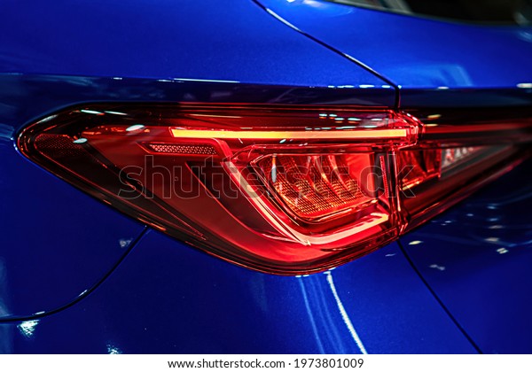 close-up of a red led taillight on a modern car,
detail on the rear light of a
car
