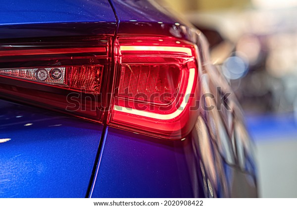 close-up of a red led taillight on a modern car,\
detail on the rear light of a\
car
