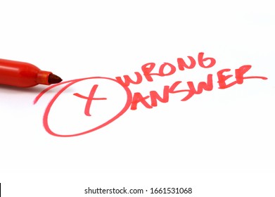 A Closeup Of A Red Marker Indicating Someones Wrong Answer In Bold Ink.