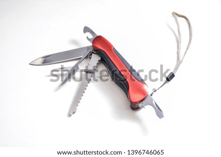 Close-up of a red multi tool penknife
