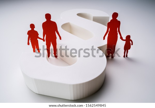 Close-up Of A Red Paper Cutout Of A Separated Family\
With White Paragraph\
Sign
