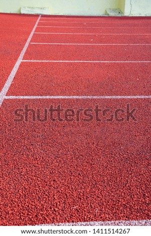 Similar – Leerer Tennisplatz mit Ballwagen und leuchtend rotem Belag