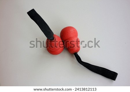 Close-up of Red Poi Balls on White Background