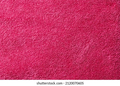 closeup of a red purple or fuchsia terrycloth fabric to be used as a background