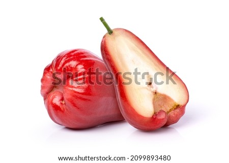 Closeup red rose apple fruit with cut in half sliced isolated on white background.