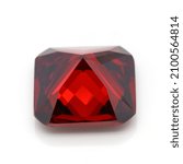 A closeup of a red ruby gemstone isolated on a white backgroud
